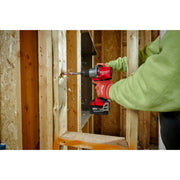 Person using a Milwaukee power drill in a construction setting