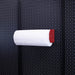 OminWall Red Magnetic Paper Towel Holder on Black Pegboard
